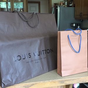 2 Louis Vuitton paper shopping bags.